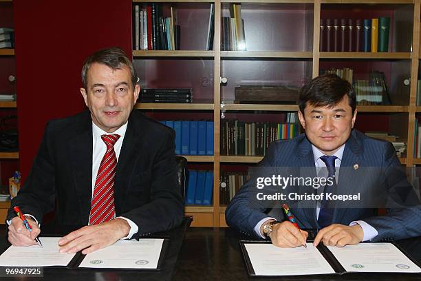 Wolfgang Niersbach, general secretary of the German Football Association, signs a cooperation treaty with Sayan Khamitzhanov, general secretary of...