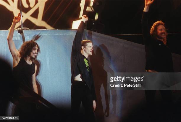 Kirk Hammett, Jason Newsted and James Hetfield of Metallica wave farewell to the audience at The National Bowl on June 5th, 1993 in Milton Keynes,...