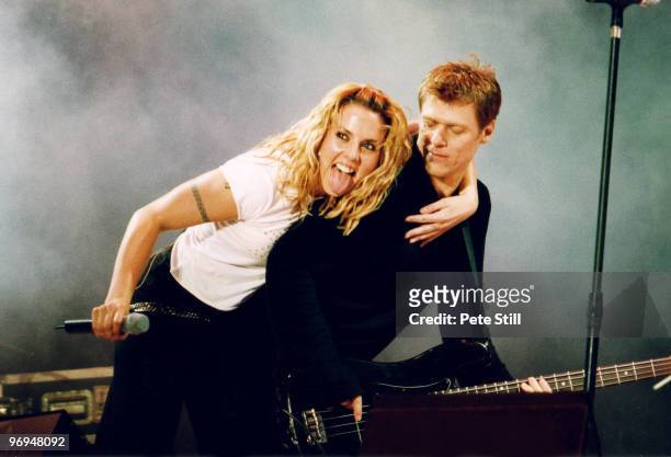 Mel C joins Bryan Adams on stage to perform at the 'Party In The Park' in Hyde Park on July 9th, 2000 in London, England.