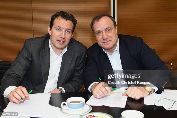 Assistant coach Marc Wilmots and national coach Dick Advocaat of Belgium pose during the meeting of the Euro 2012 qualifier opponents with national...