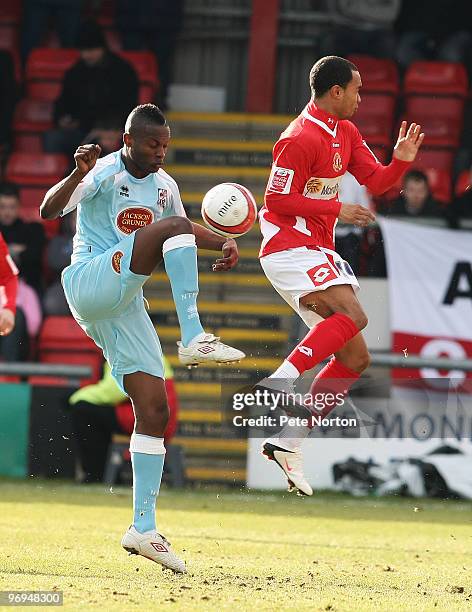 Abdul Osman of Northampton Town challenges for the ball with Byron Moore of Crewe Alexandra during the Coca Cola League Two Match between Crewe...