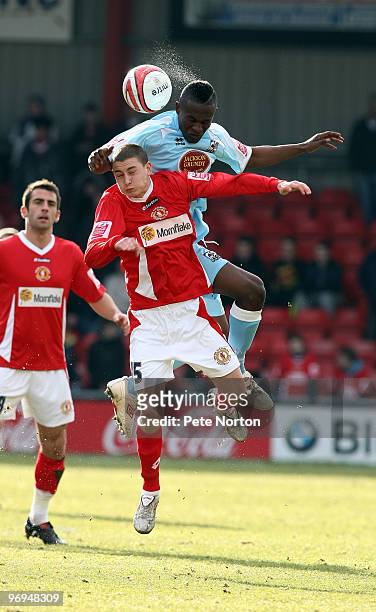 Abdul Osman of Northampton Town challenges for the ball with Shaun Miller of Crewe Alexandra during the Coca Cola League Two Match between Crewe...