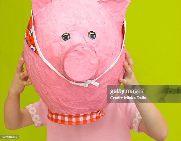 child holding paper pink pig - papier stock pictures, royalty-free photos & images