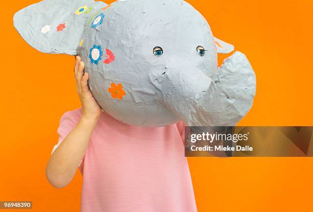 child holding paper elephant - papier mache bildbanksfoton och bilder
