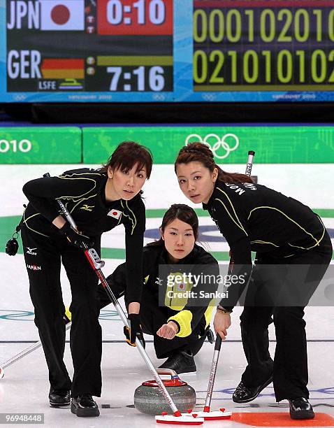 Kotomi Ishizaki, Moe Meguro and Mari Motohashi compete during the women's curling round robin game between Japan and Germany on day 10 of the...