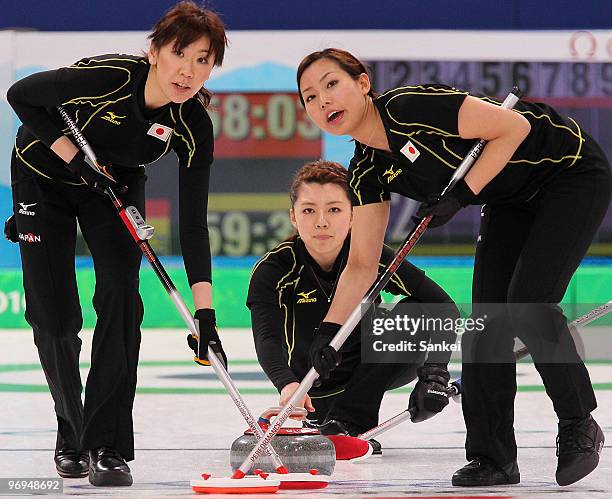 Kotomi Ishizaki, Mari Motohashi and Anna Ohmiya of Japan look on during the women's curling round robin game between Japan and Germany on day 10 of...