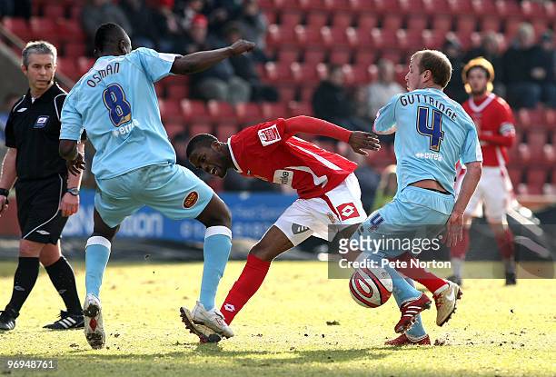 Joel Grant of Crewe Alexandra looks for the ball with Abdul Osman and Luke Guttridge of Northampton Town during the Coca Cola League Two Match...