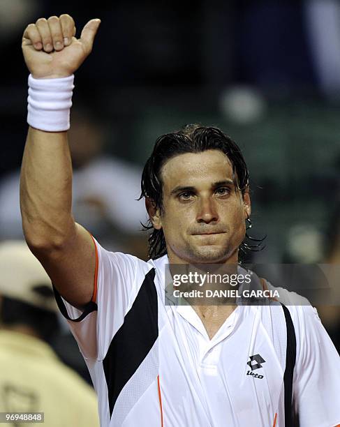 Spanish David Ferrer waves to spectators after winning to compatriot Albert Montanes in their ATP semifinal match at the Lawn Tennis Club in Buenos...