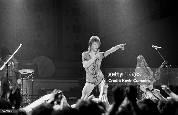 English singer David Bowie performs on stage with guitarist Mick Ronson at Free Trade Hall in Manchester as part of the Ziggy Stardust / Aladdin Sane...
