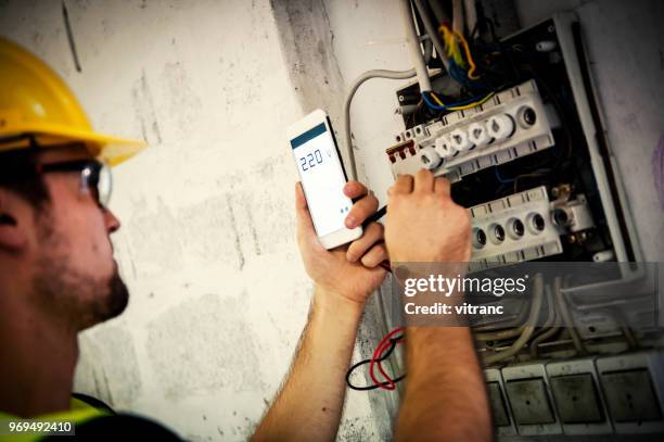 man reading electric meter - meter instrument of measurement stock pictures, royalty-free photos & images