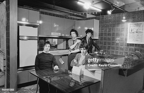 Guitarist Steve Diggle, singer Pete Shelley ,drummer John Maher and bassist Steve Garvey of English punk band the Buzzcocks in a kitchen on November...