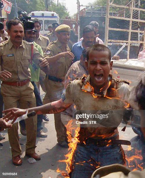 Indian student Yadaiah reacts as he immolates himself during a protest in Hyderabad on February 20, 2010. A student tried to set himself ablaze as...