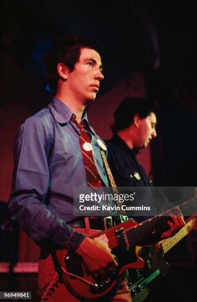 Singer Pete Shelley and bassist Garth Smith of British punk band the Buzzcocks perform on stage at the Electric Circus in Manchester, England in 1977.
