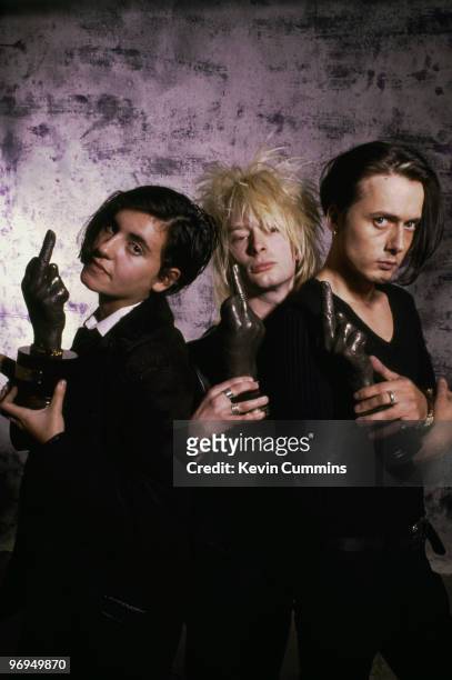 Justine Frischmann of Elastica, Thom Yorke of Radiohead and Brett Anderson of Suede holding awards at the 1993 NME Brat Awards.