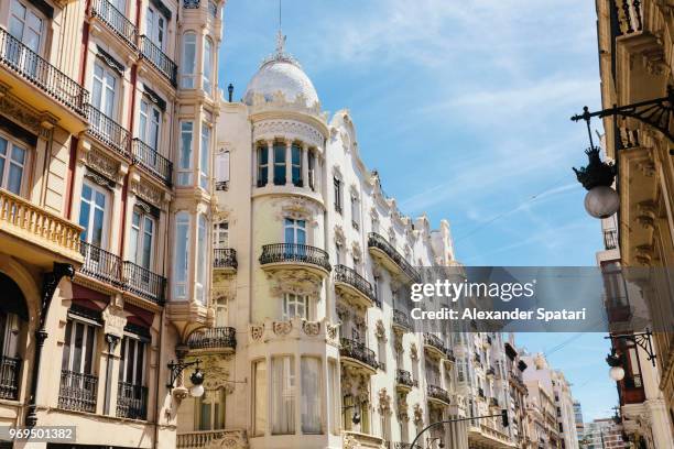 street with old historical buildings in valencia, spain - valencia spain stock pictures, royalty-free photos & images