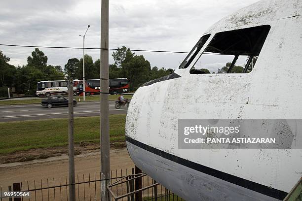 View of the Interbalnaria road and the dilapidated cockpit of a decommissioned Uruguayan Air Force Fokker-Fairchild F27, similar to the plane that...