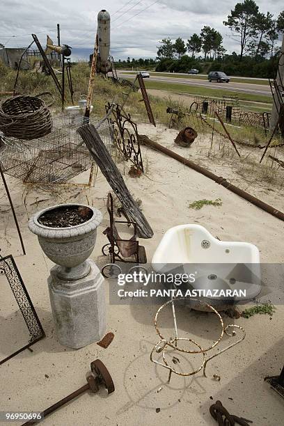 Old bed headboards, plumbing furniture and a deactivated aircraft iron bomb are some of the objects on display at a junk store situated at one side...