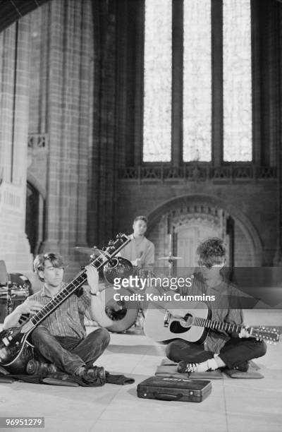 Will Sergeant, Pete De Freitas and Ian McCulloch of British band Echo and the Bunnymen perform on stage in Liverpool Cathedral on August 18, 1983.