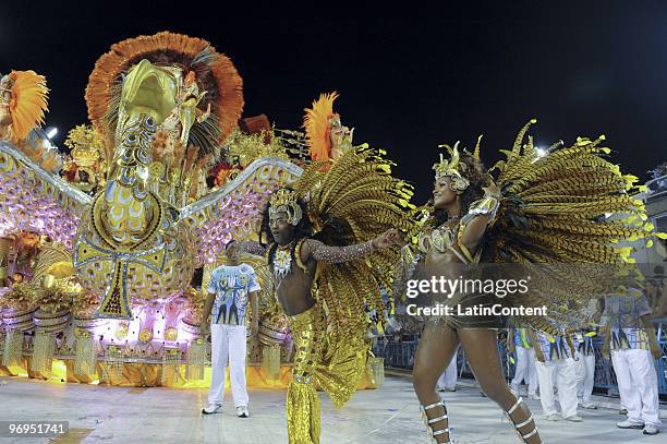 Members of Beija Flor Samba School dance during Rio de Janeiro's Carnival Champions Parade at Marques de Sapucai Sambodrome on February 21, 2010 in...