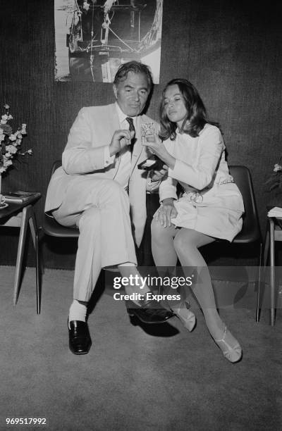 English actor James Mason with Franco-American Leslie Caron, who is looking at the British Film Institute's Alexander Korda Star award that Mason...