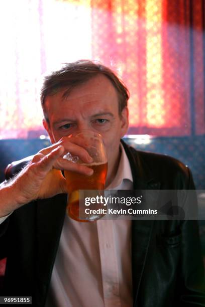 Singer-songwriter of British band The Fall Mark E. Smith sits in a pub on 22 August 2005.