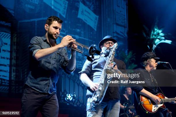 Christoph Moschberger, Axel Mueller and Wolfgang Niedecken perform with BAP at Lanxess Arena on June 2, 2018 in Cologne, Germany.