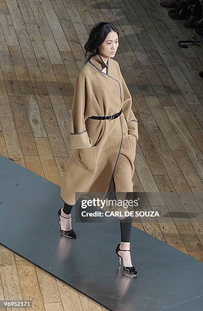 Model presents a creation by fashion designer Nicole Farhi during her show at the Royal Opera House, London during the fifth day of London Fashion...