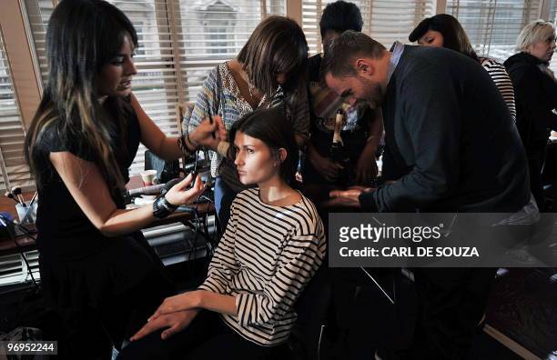 Model has her make up applied backstage before a show by fashion designer Nicole Farhi at the Royal Opera House, London, during the fifth day of...