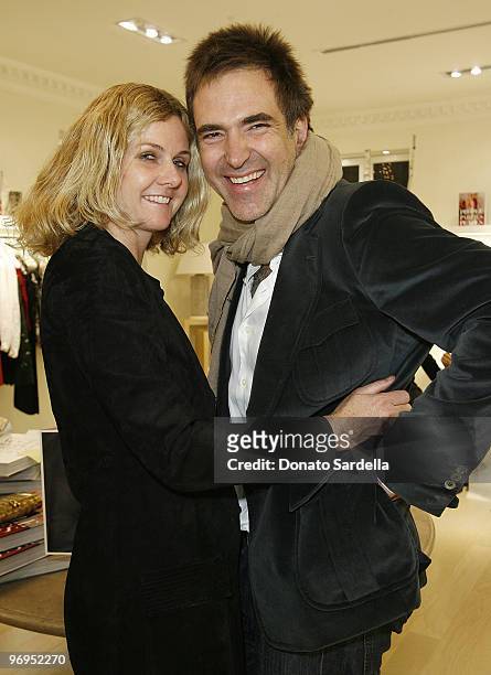 Susan Traylor and Constantin Kakania attend The World in Vogue: Oscar de la Renta Book Signing Party with Hamish Bowles on December 14, 2009 in...