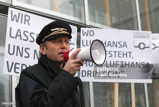 Winfried Streicher, president of Vereinigung Cockpit, speaks into a megaphone during a pilots' strike at Rhein-Main Airport in Frankfurt, Germany, on...