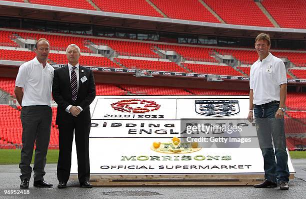 Alan Shearer and Teddy Sheringham pose alongside Mark Gunter, Morrisons Group Retail Director, for the media during a photo call to promote the...