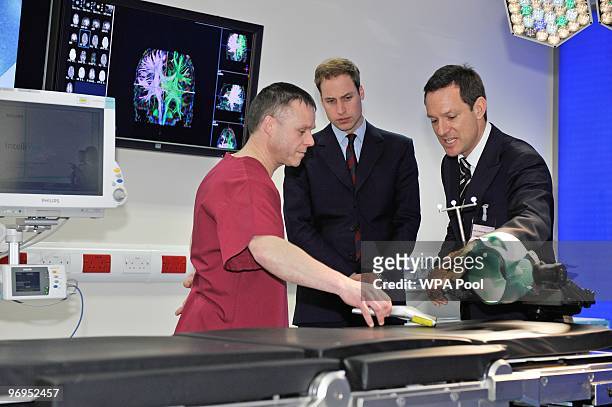 Prince William stands with theatre manager Steve Allen and consultant paediatric neurosurgeon Conor Mallucci . As he makes a visit to Alder Hey...