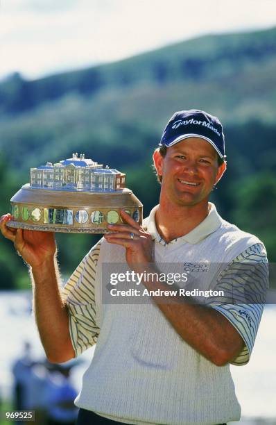 Retief Goosen of South Africa lifts the winning trophy after winning the Scottish Open held at the Loch Lomond Golf Club, in Scotland. \ Mandatory...