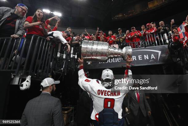 Alex Ovechkin of the Washington Capitals carries the Stanley Cup to the dressing room after his team defeated the Vegas Golden Knights 4-3 in Game...