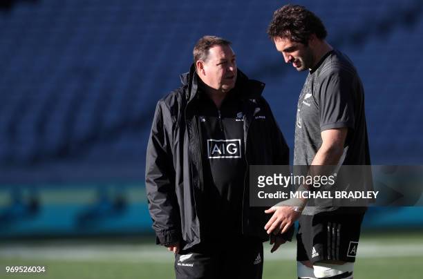 New Zealand's rugby team coach Steve Hansen and captain Sam Whitelock attend the captain's run training session at Eden Park in Auckland on June 8...