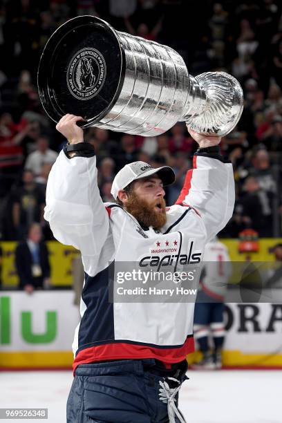 Braden Holtby of the Washington Capitals hoists the Stanley Cup after his team defeated the Vegas Golden Knights 4-3 in Game Five of the 2018 NHL...