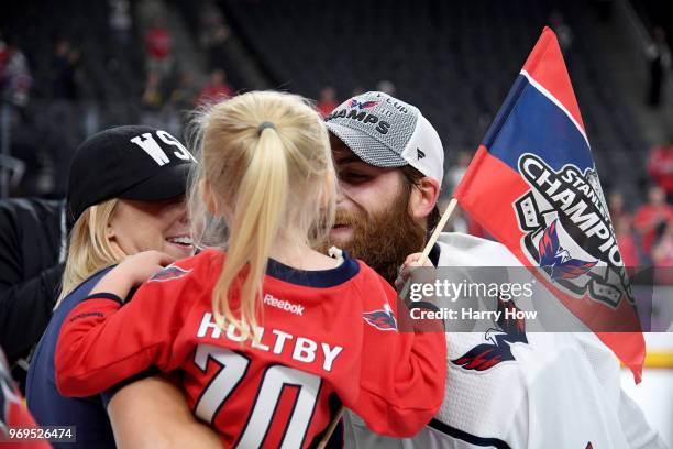 Braden Holtby of the Washington Capitals celebrates with his daughter after his team's win over the Vegas Golden Knights in Game Five of the 2018 NHL...