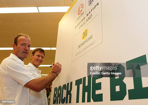 Alan Shearer and Teddy Sheringham pose for the media as they sign an official back the bid board during a photo call to promote the launch of...