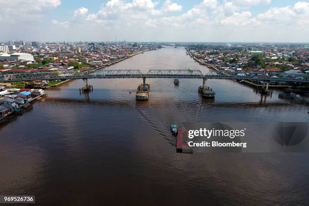 Barge navigates the Kapuas river in this aerial photograph taken in Pontianak, West Kalimantan, Indonesia, on Saturday, May 5, 2018. Indonesia has...