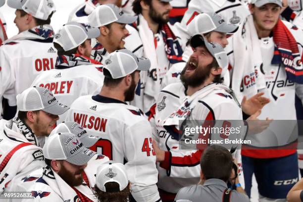 Alex Ovechkin of the Washington Capitals reacts with Tom Wilson after their team defeated the Vegas Golden Knights 4-3 in Game Five of the 2018 NHL...