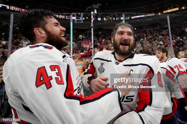 Alex Ovechkin of the Washington Capitals reacts with Tom Wilson after their team defeated the Vegas Golden Knights 4-3 in Game Five of the 2018 NHL...
