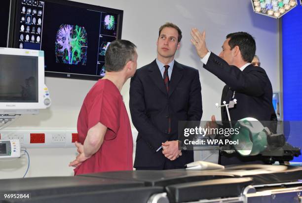 Prince William stands with theatre manager Steve Allen and consultant paediatric neurosurgeon Conor Mallucci . As he makes a visit to Alder Hey...