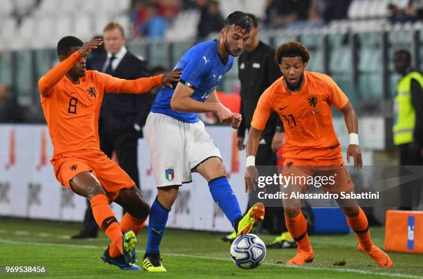 Bryan Cristante of Italy competes for the ball whit Georginio Wijnaldum and Tonny Vilhena of Netherlands during the International Friendly match...