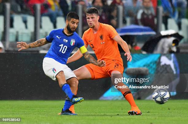 Lorenzo Insigne of Italy competes for the ball whit Hans Hateboer of Netherlands during the International Friendly match between Italy and...