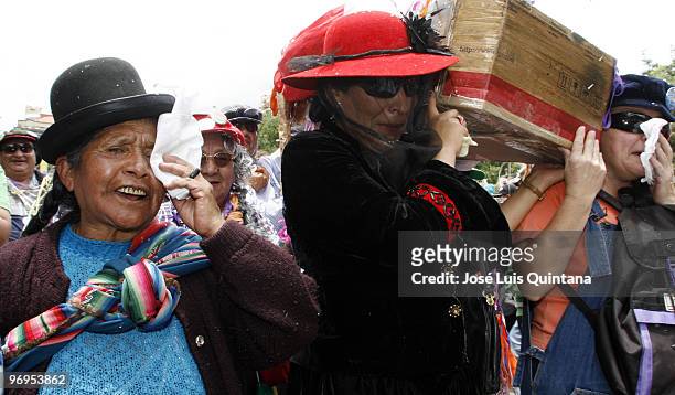 Revelers accompany the procession during the celebration of La Muerte del Pepino in the way of the Cemetery General de La Paz on February 21, 2010 in...