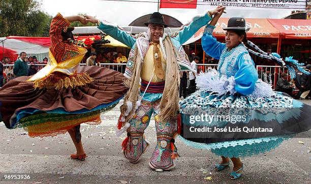 Revelers accompany the procession during the celebration of La Muerte del Pepino in the way of the Cemetery General de La Paz on February 21, 2010 in...