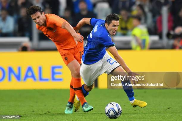 Federico Chiesa of Italy competes for the ball whit Daryl Janmaat of Netherlands during the International Friendly match between Italy and...