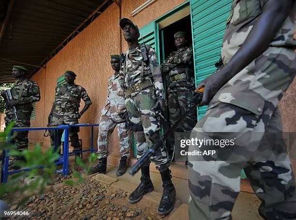 Niger's soldiers stand guard outside the office of Salou Djibo, leader of the coup that overthrew president Mamadou Tandja, on February 21, 2010 at a...