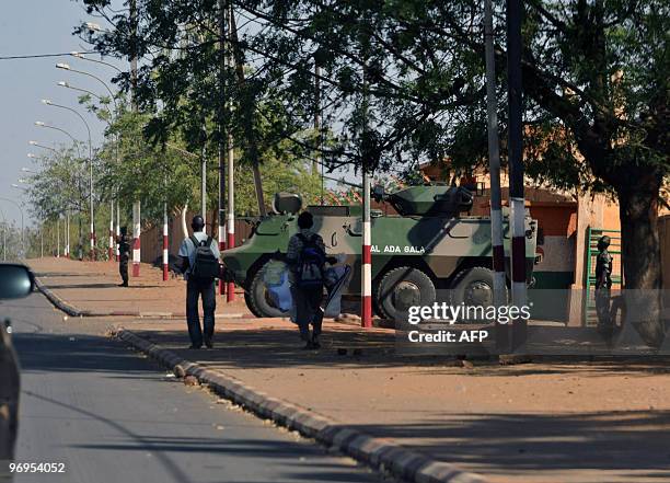 Niger's soldiers in an APC stand guard outside the office of Salou Djibo, leader of the coup that overthrew president Mamadou Tandja, on February 21,...