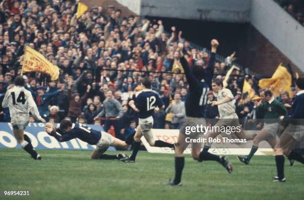 Euan Kennedy dives over to score Scotland's second try in the Rugby Union International between Scotland and England at Murrayfield Stadium,...